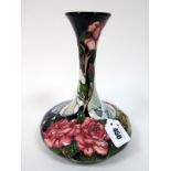 A Modern Moorcroft Pottery Vase, of trumpet form, painted in the Coronation Day pattern