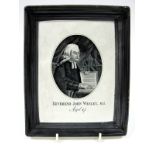 An Early XIX Century Pearlware Plaque, printed in black with a portrait of John Wesley, in an oval