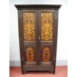 A Late XIX Century Oak Hall Wardrobe, with panelled doors inlaid with marquetry foliate scroll