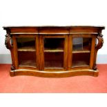 A XIX Century Rosewood Serpentine Shaped Sideboard, the top with moulded edge, three small drawers