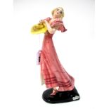 A Goldscheider Pottery Figure, designed by Dakon, modelled as a lady in a dancing pose, wearing a