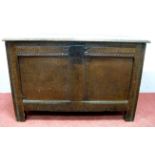 A Late XVII Century Oak Coffer, the hinged lid with moulded edge, twin recessed panel front