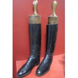 A Pair of Edwardian Gentleman's Stitched Black Leather Riding Boots, with wooden boot trees.