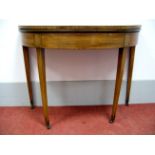 A Late XVIII Century Mahogany Demi-Lune Card Table, with crossbanded fold-over top, baized interior,