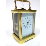 A Modern French Carriage Clock, the petite sonnerie movement striking on a coiled gong, the white