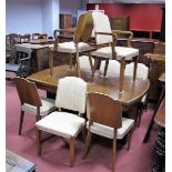 A 1920's Walnut Dining Table, the oval top with moulded edge, on twin pedestals, 80cms high, 74cm