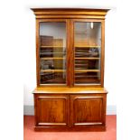 A XIX Century Mahogany Bookcase, with stepped cornice, double glazed doors to four internal shelves,