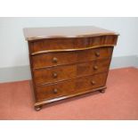 A XIX Century Mahogany Chest of Drawers, with serpentine shaped top drawer over three further