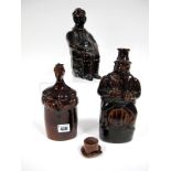 A Mid XIX Century Treacle Glazed Stoneware Flask, modelled as a gentleman seated astride a barrel,