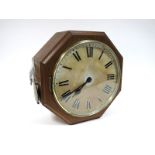 A G.P.O. Double Sides Pendulum Wall Clock, in an oak case, enamel dial with Roman numerals and