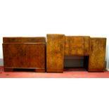 A Burr Walnut Sideboard, with stepped top, moulded edge, three central drawers flanked by cupboards,