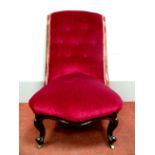 A XIX Century Rosewood Nursing Chair, with upholstered back and seat, on cabriole legs.