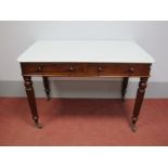 A XIX Century Mahogany Washstand, with marble top, two short drawers on turned and reeded legs, 73cm