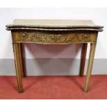 A Late XVIII Century Mahogany Card Table, the serpentine front with a carved edge of flower heads,