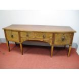 An Early XX Century Mahogany Bow Fronted Sideboard, fitted with two central drawers between flanking