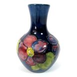 A Moorcroft Pottery Vase, of baluster form, painted in the Anemone pattern with pink and purple