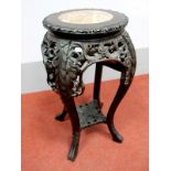 A Late XIX Century Chinese Hardwood Stand, with rouge marble inset, pierced and carved decoration,