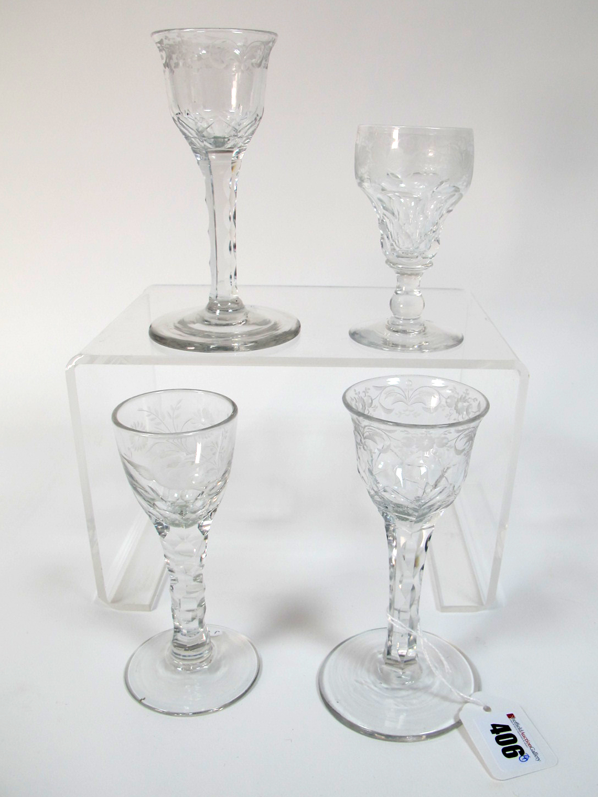 A XIX Century Wine Glass, the ogee bowl etched with a bird and flowers, raised on faceted stem and
