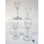 A XIX Century Wine Glass, the ogee bowl etched with a bird and flowers, raised on faceted stem and