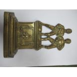 A XIX Century Brass Door Stop, featuring two period footballers stood on stepped base with another