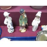 Three Lladro Figurines, basket girl E-8S, footballer F-28A, clown (in matt). (3)