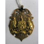 A 9ct Gold Medallion Pendant, (marks rubbed), inscribed "Presented by Methley Infy Commee to