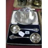 A Decorative pair of Plated Serving Spoons, each with pierced handles and circular bowl, in original
