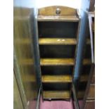 A 1920's Oak Slender Bookcase, with four shelves and low back.