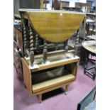 An Oak 1930's Barley Twist Gateleg Table, having oval top; A mid XX Century adjustable tea