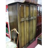 An Oak Double Wardrobe and Dressing Table, with knulled decoration. (2)