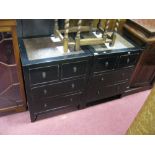 An Oriental Style Black Lacquer Pair of Bedside Chests, with cross banded tops, two small and two