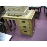 An Oak Pedestal Desk, with a rectangular top, pedestal with three small drawers.