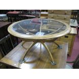 A 1970's Teak Circular Coffee Table, in the G Plan style, having glass inset top on pentagonal