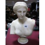 A XIX Century White Marble Bust of a Lady, mounted on a socle base.