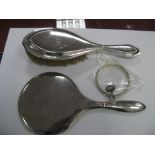 A Hallmarked Silver Backed Hand Mirror, together with a hair brush, a triple bangle, a ring (