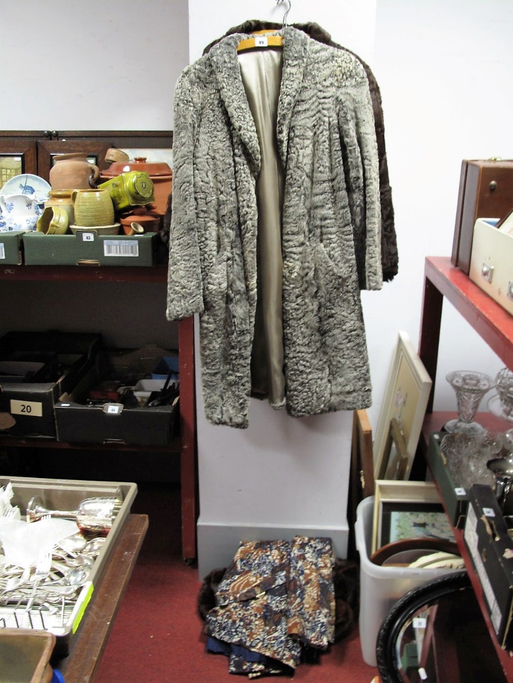An Aquascutum Coat, two fur capes and a lambs wool coat.