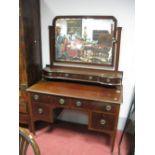 An Early XX Century Mahogany Dressing Table, with a central mirror, jewel drawers, base with four