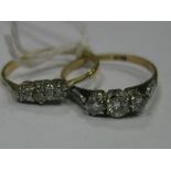 A Three Stone Diamond Ring, claw set, together with a smaller example. (2)