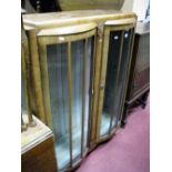 A 1930's Walnut Double Bow Front China Cabinet.