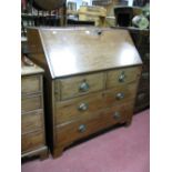 A XIX Century Mahogany Bureau, with fall front, fitted interior, over two short and two long