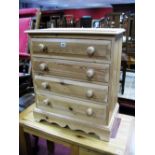A Small Pine Chest of Drawers, with four long drawers, on a plinth base.