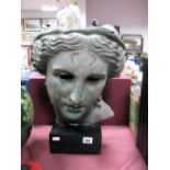 A Late XX Century Classical Female Bust, on black rectangular pedestal.