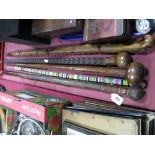An African Bead Work Cane, 76cm long, two Oriental carved canes, diamond carved cane, another with