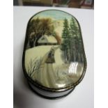 A Mid XX Century Russian Papier Mâché Trinket Box, of oval form, the lid painted with winter scene