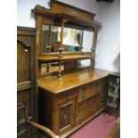 A XIX Century Oak Mirror Back Sideboard, with twin pillars, three bevelled mirrors and pokerwork