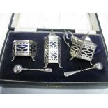 A Hallmarked Silver Three Piece Cruet Set, each of openwork hexagonal form, together with matching