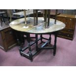 An XVIII Century Joined Oak Gate Leg Table, with oval top and single drawer, on turned and block