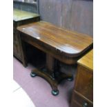 A XIX Century Rosewood Card Table, with a rectangular fold over top, baized interior, quatrefoil