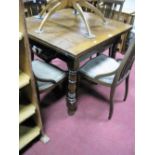 A 1930's Oak Draw Leaf Table, on turned legs, united by 'X' stretcher.