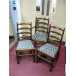 A XX Century Set of Six Ladder Back Chairs, two arms, four single chairs, with drop in seats, on